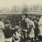 築地本願寺燒跡に於ける配給米受取の狀況<br>People queue to receive distributions of rice from Honganji Temple, Tsukiji<br>Source: 大正震災志寫眞帖  內務省社會局編, 1926