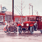 (復興祭御巡幸記念) 京橋三原橋通御の鹵簿と花電車<br>Imperial procession travels along Miharabashi-dōri, Kyōbashi, alongside a tram decorated with flowers<br>Source: Postcard, 1930